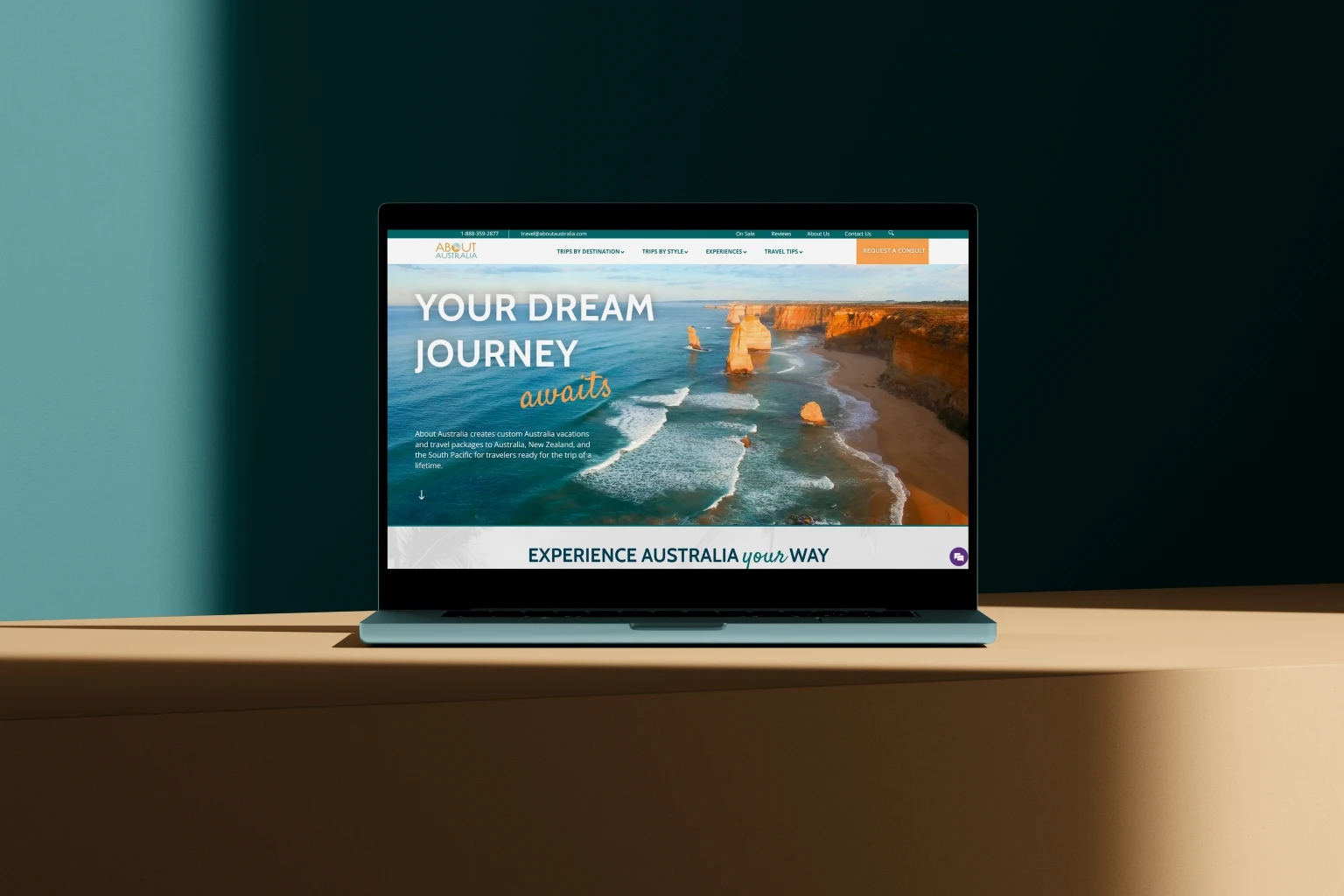 About Australia travel website laptop mockup showing Your Dream Journey awaits tagline with Twelve Apostles coastal rock formations hero image